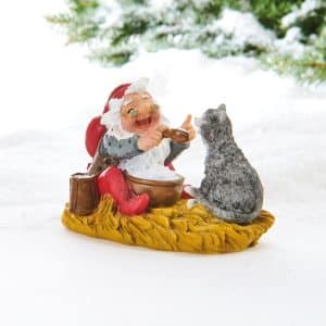 Julemanden spiser risengrød med katten