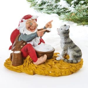 Julemanden spiser risengrød med katten stor